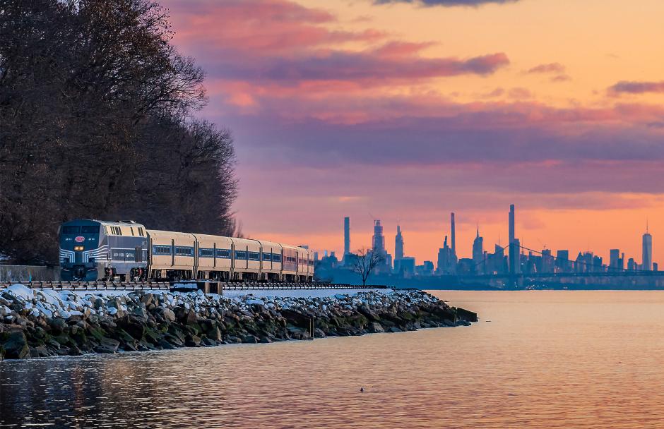 Chris Healy Metro-North Train 8835 heads northbound on the Hudson Line just before sunset on February 13, 2024, led by New York Central heritage P32AC-DM No. 211. After a significant snowstorm swept through the New York metro area that morning, the evening brought clearing skies, soft winter light, and the last traces of melting snow.