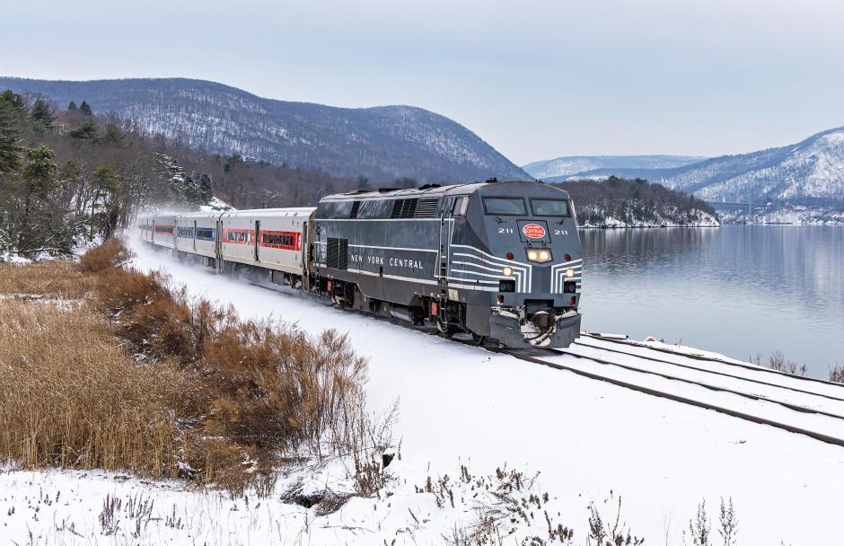 New York Central heritage P32AC-DM No. 211 travels north of Manitou in the winter of 2025, right at home along the Hudson Line — a route built by the railroad whose classic paint scheme it proudly commemorates.