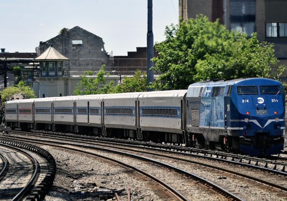 A Metro-North Railroad train on a train track. 