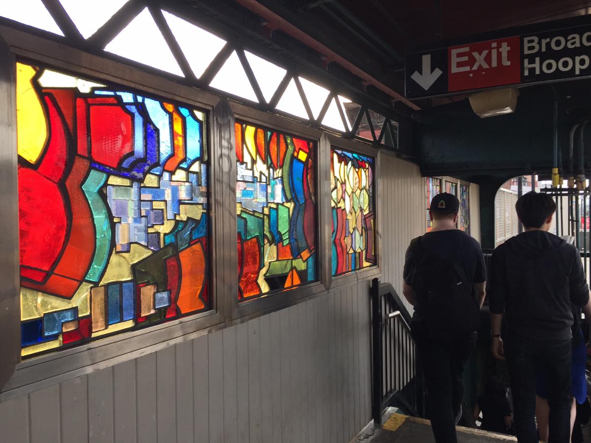 Artwork in faceted glass by Mara Held showing colorful geometric patterns and overlapping forms. 