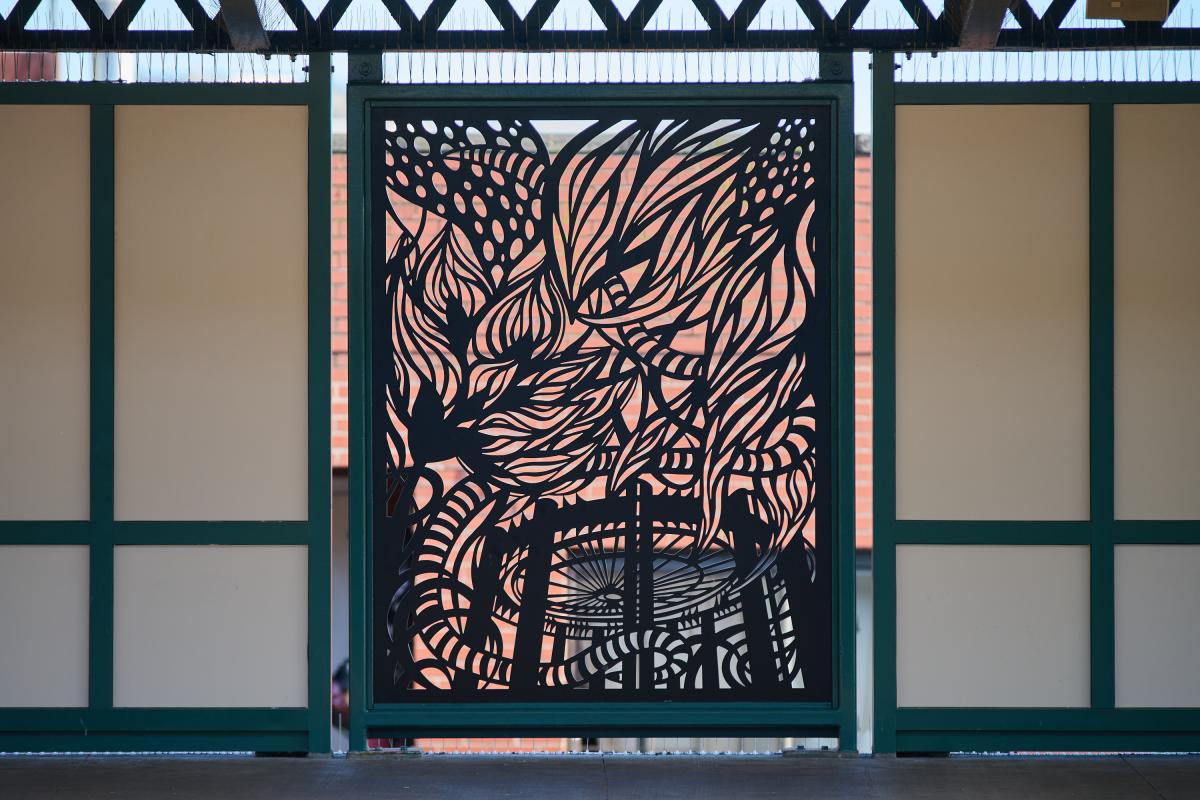 Metal artwork in platform windscreen.