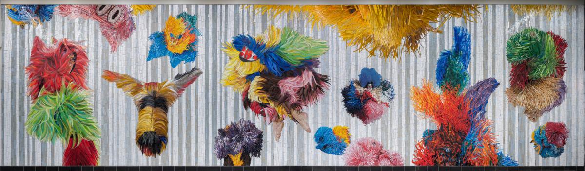 A vibrant mosaic artwork, featuring a variety of colorful, furry shapes arranged in a playful, organic layout. 