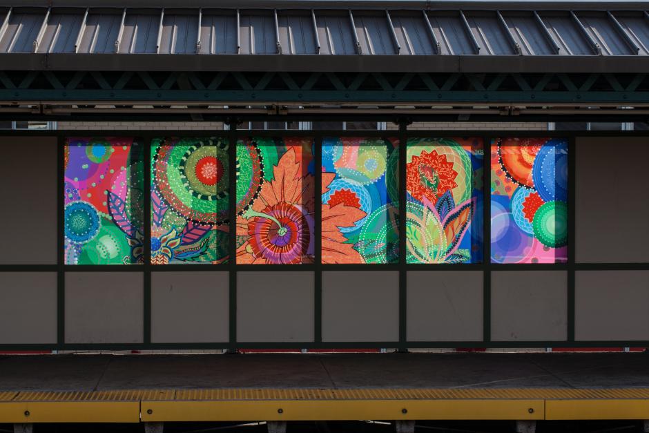 Artwork in laminated glass by Amy Cheng showing bright colors in abstract forms. 