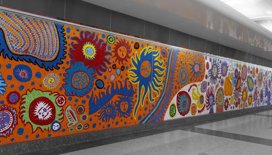 An image depicting a mosaic artwork with many amoeba like faces.