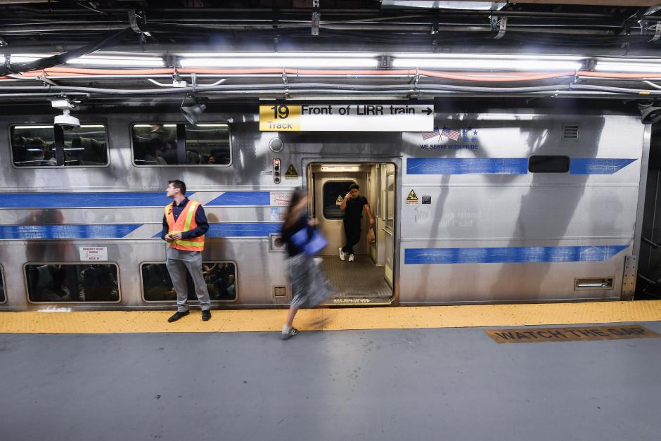 Passengers boarding an LIRR train at the platform