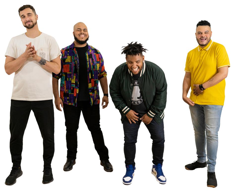 Four men dressed in various colored shirts and full beards, all smiling in front of a white background.