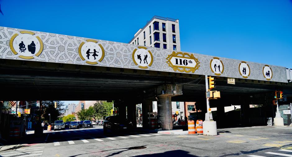 Street-level view of metal artwork attached to Park Avenue Viaduct.