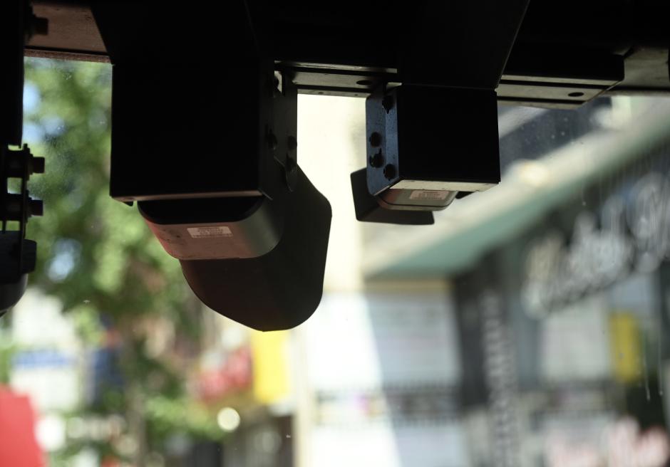 Automated Camera Enforcement equipment behind the windshield of a bus