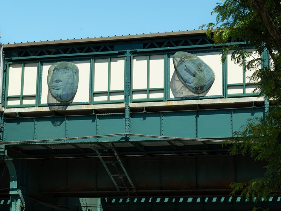 Metal mesh sculptures on the side of a station.