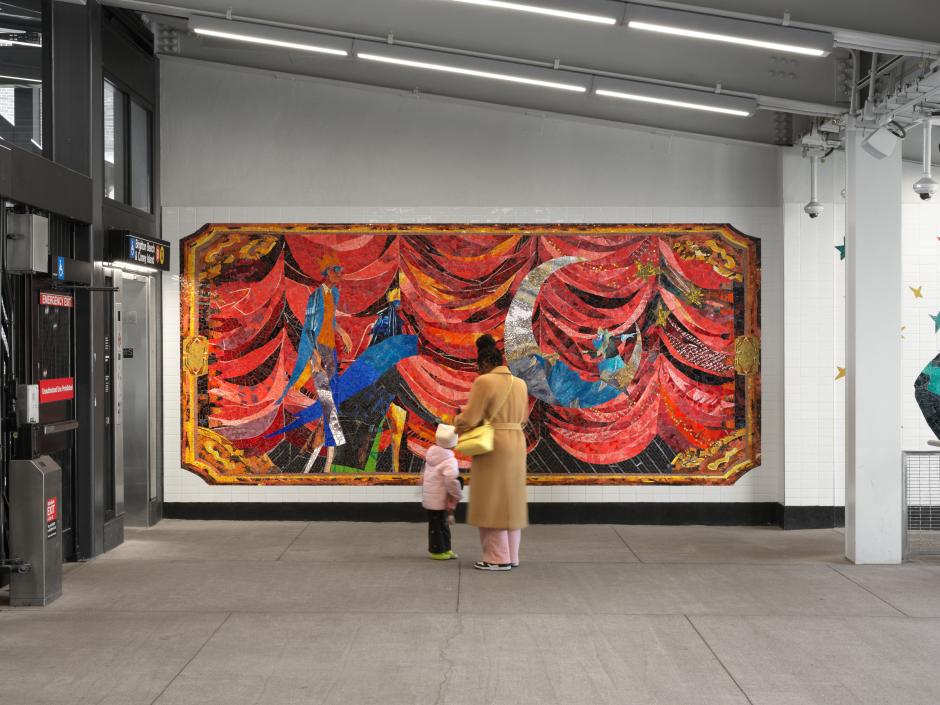 A person and a child view a mosaic featuring two people with crowns and a silver moon atop a bold red gestural backdrop at Church Av station.