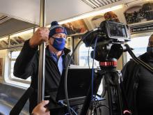 mta chairman pat foye on a 7 train on his way to citi field