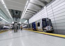 A train pulling into a large station. 