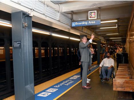 Janno Lieber and Quemuel Arroyo checking out new accessibility features on a platform at 66 St-Lincoln Center station.