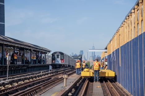 A 7 train at an elevated station that is under construction